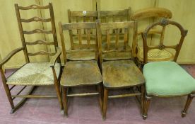 A SET OF FOUR ELM SEATED TRIPLE SPLATBACK CHAIRS, a rush seated ladderback polished rocking chair, a