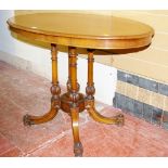 A VICTORIAN MAHOGANY LOO TABLE, the oval top with moulded edge on four turned column supports,