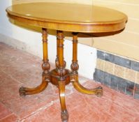 A VICTORIAN MAHOGANY LOO TABLE, the oval top with moulded edge on four turned column supports,