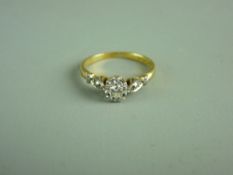 A LADY'S EIGHTEEN CARAT GOLD & PLATINUM SOLITAIRE DIAMOND RING with flanking marcasites, visual