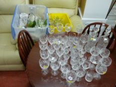 Good quantity of fine quality drinking glassware, two decanters and two tubs of glassware