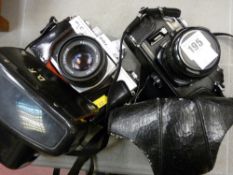 Two vintage cameras by Ricoh x R7 and Praktica PLC2