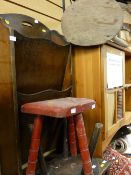 Polished two door cupboard, polished magazine rack and three rustic stools