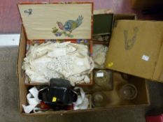 Box of miscellaneous items including vintage linen, photographic items, glass decanter etc
