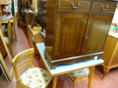 Mid Century melamine top draw leaf table with accompanying chairs and a two door cupboard
