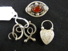 Pair of Charles Horner silver looped clips, a silver bright cut heart shaped agate backed locket and