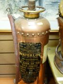 Vintage copper fire extinguisher with label