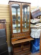 Excellent two door modern china cabinet with bevelled glass and similar entertainment cupboard