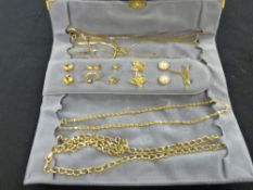 Wallet of yellow metal necklaces, earrings etc