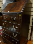 A reproduction mahogany ladies' bureau