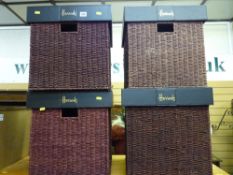 Four Harrods wicker storage boxes with leather-effect lids, one with soft toy contents