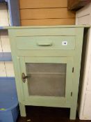 A vintage painted food cupboard