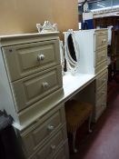 A white melamine twin-pedestal dressing chest, two-drawer bedside chest, dressing stool & triple