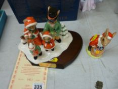 A boxed Royal Doulton Merry Christmas Bunnykins tableau group DB194 & a Royal Doulton Santa