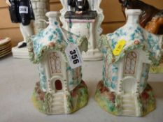 A pair of Staffordshire pottery cottage money boxes