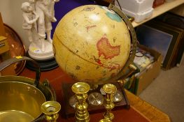 A vintage globe on plinth with barometer etc