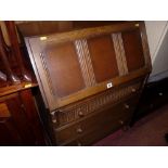 A Priory-style oak front bureau