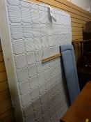 A 4ft6 memory foam mattress with an upholstered headboard