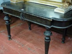 A continental ebonized display table with shallow carved detail on turned & reeded supports