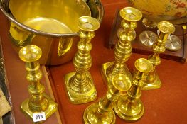 Three pairs of brass candlesticks