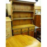 A modern pine dresser & matching circular table with green highlighting