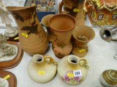 A quantity of vintage floral decorated jugs & vases