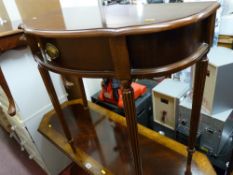 A reproduction single drawer serpentine front hall table