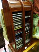 A double tumble front CD rack with music contents mainly classical?