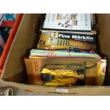 A box of auction catalogues, many featuring good toys