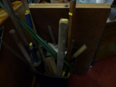 A tub of long handle garden tools etc.