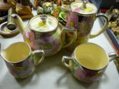 A four-piece Arthur Wood floral decorated tea set
