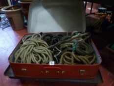 A suitcase of ropes & a small trolley