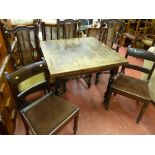 An oak draw leaf dining table on barley-twist supports, three bergere backed dining chairs & two