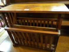 A hardwood magazine stand with brass inlaid top