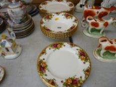 Six Royal Albert 'Country Roses' dinner plates, six dessert plates & six fruit or soup bowls