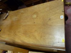 An antique mahogany gateleg dining table