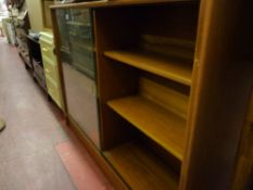 A teak glass fronted bookcase