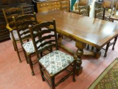 AN EXCELLENT REPRODUCTION OAK DRAW LEAF DINING TABLE and a matched set of six (four plus two)