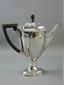 A SILVER OVAL BASED COFFEE POT with tapered and patterned body, with Arts & Crafts style decoration,