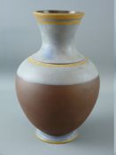 AN UNUSUAL WEDGWOOD STONEWARE VASE, the upper part and foot with bands of faded blue and ochre,