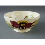 A MOORCROFT 'COLOMBINE' 16 cms DEEP DISH BOWL, decorated on a cream ground, impressed Moorcroft to