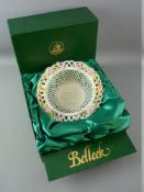 A BOXED BELLEEK CHINA WOVEN BASKET with double strand base and a wide floral decorated looped border