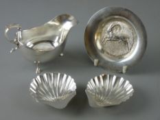 A PARCEL OF SILVER to include a Sheffield 1945 sauce boat by Walker & Hall, 3.6 troy ozs, a pair