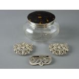 A SILVER BUCKLE, a two piece nurse's buckle and a silver and tortoiseshell lidded dressing table