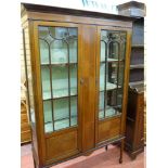 AN EDWARDIAN LINE INLAID TWO DOOR CHINA DISPLAY CABINET with cloth covered back and interior and