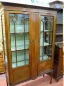 AN EDWARDIAN LINE INLAID TWO DOOR CHINA DISPLAY CABINET with cloth covered back and interior and