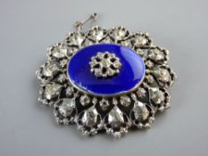 AN OVAL SILVER BROOCH, London 1954 with a central oval blue enamel tablet with centre cz