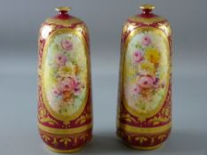 A PAIR OF CRIMSON GROUND ROYAL BON VASES, bottle shaped with narrow necks, profuse decoration of