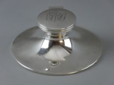 A LARGE CIRCULAR SILVER INKWELL, monogrammed lid, London 1914