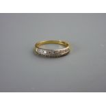 AN EIGHTEEN CARAT GOLD HALF HOOP ETERNITY RING, marked 'E & W', 3.8 grms, size 'N'